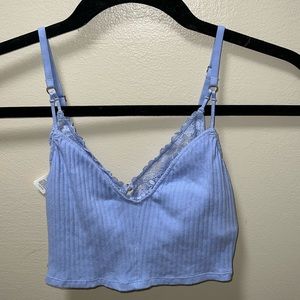 Never worn perry winkle tank top from Arie. Size:XS. Has a sexy built in bra